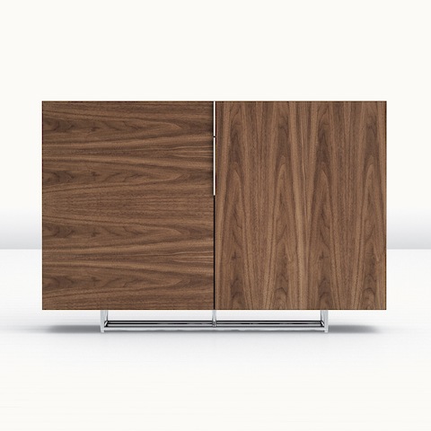 A Domino Storage sideboard with a medium wood finish and two doors with contrasting grain patterns.