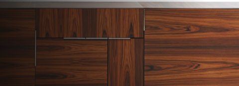 Partial front view of a Domino Storage credenza with a dark wood finish and a mix of doors, drawers, and grain patterns.