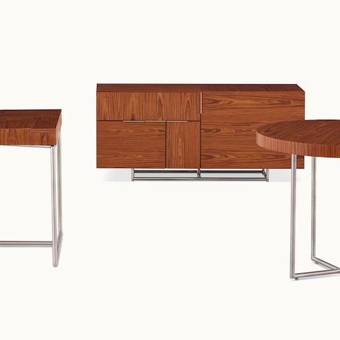 A Domino Table, Domino Desk, and Domino Storage credenza, all with matching wood veneer and metal finishes.