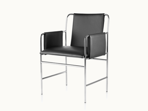 Angled view of an Envelope side chair with black leather upholstery and a tubular steel frame.