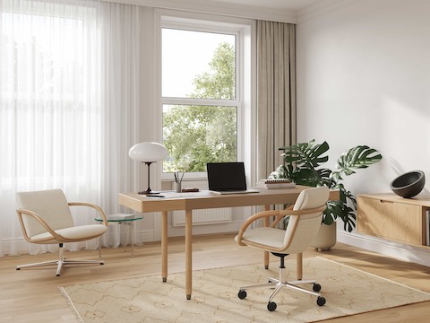 Full Loop office chair at a Leatherwrap Sit-to-Stand Desk home office setting, with the Full Loop Lounge Chair and Geiger One floating credenza.