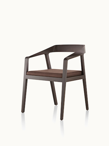 Angled view of a Full Twist Guest Chair with a brown fabric seat pad and a wood frame in a dark finish.