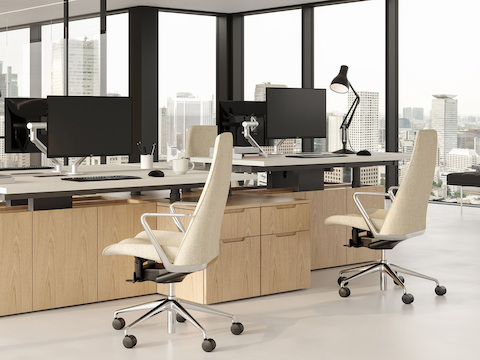 Geiger One Open Plan workstations in Natural Oak with Taper Chairs.