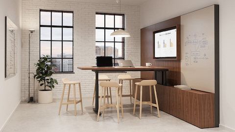 Geiger One Meeting and Huddle Room in Natural Walnut with Crosshatch Stools.