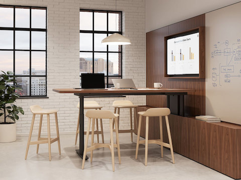 Geiger One Meeting and Huddle Room in Natural Walnut with Crosshatch Stools.