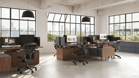 Geiger One Open Plan workstations in Natural Walnut with Aeron Chairs.