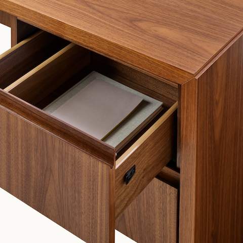 Geiger One Casegoods Mitered Stand-Alone Desk with open drawer and styling.