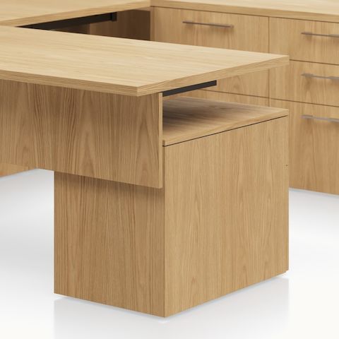 Detail shot of the Geiger One Casegoods box file pedestal leg option in Natural Flat Cut Oak.