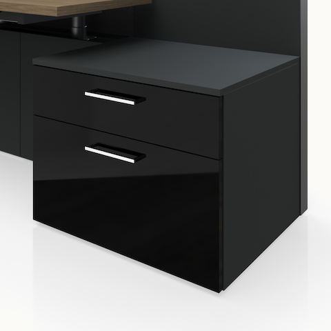 Detail shot of the Geiger One Casegoods storage with a Charcoal TFL case and black high gloss acrylic fronts.