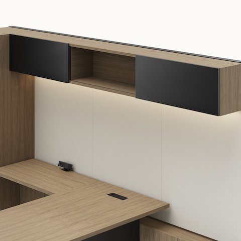 Detail shot of the Geiger One Casegoods overhead with sliding doors option in a Natural Flat Cut Walnut private office viewed from an angle.