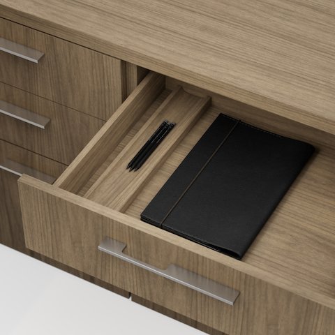 Detail shot of the Geiger One Casegoods drawer interior in Natural Flat Cut Walnut viewed from an angle.