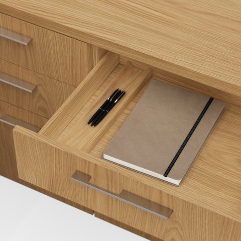 Detail shot of the Geiger One Casegoods drawer interior in Natural Flat Cut Oak viewed from an angle.