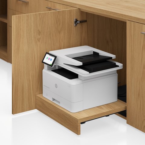 Detail shot of the Geiger One Casegoods printer drawer in Natural Flat Cut Oak viewed from an angle.