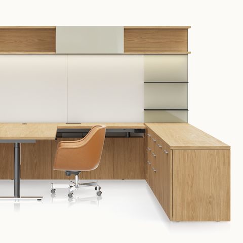 A Geiger One Private Office in Natural Flat Cut Oak with a Bumper Office and Side Chair in camel leather viewed from the front.