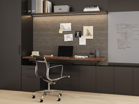 Geiger One Private Office in Black TFL and Solid Walnut desk with Eames Aluminum Group Chair.