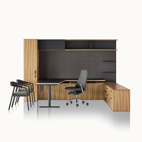 A private office featuring Geiger One Casegoods with a peninsula work surface and storage, a Taper office chair, and two Full Twist Guest Chairs.