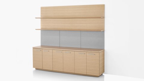 Angled view of a Geiger Shelf System in a light rift oak finish, featuring six lower cabinets and two upper shelves.