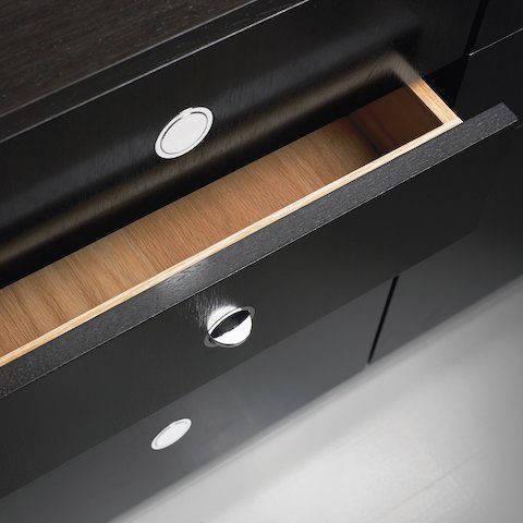 Overhead view of a partially open drawer in an H Frame Storage credenza, showing the flush-mounted Flip pulls.