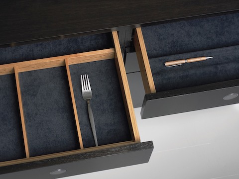 Overhead view of two open drawers in an H Frame Storage credenza, showing optional inserts for organizing supplies.