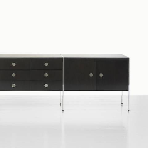 A two-unit H Frame Storage credenza with a dark wood finish and modules for box drawers and enclosed cabinets.