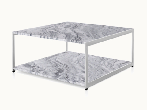 Angled view of an H Frame coffee table with a metal frame and stone upper and lower surfaces.
