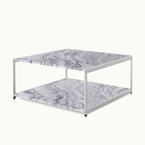 Angled view of an H Frame coffee table with a metal frame and stone upper and lower surfaces. Select to go to the H Frame Tables product page.