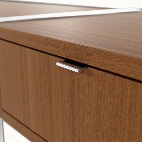 Detail shot of pull tabs on Highline Credenza by DatesWeiser in Natural Quarter Cut Walnut with Polished Chrome legs and pull tabs.