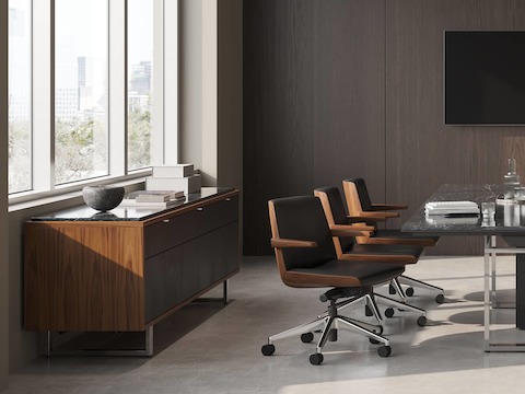 Highline Conference Table and Highline 25 Credenza by DatesWeiser in Black Granite with Clamshell Chairs in conference room.