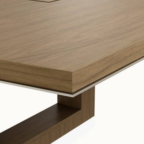 Edge detail shot of a boat-shaped Highline Fifty Conference Table by DatesWeiser in Natural Flat Cut Walnut with a Satin Nickel edge.