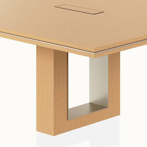 Rectangular Highline Fifty Conference Table by DatesWeiser in Natural Rift Cut Oak with a Satin Nickel edge and base trim viewed from a 45 degree angle.