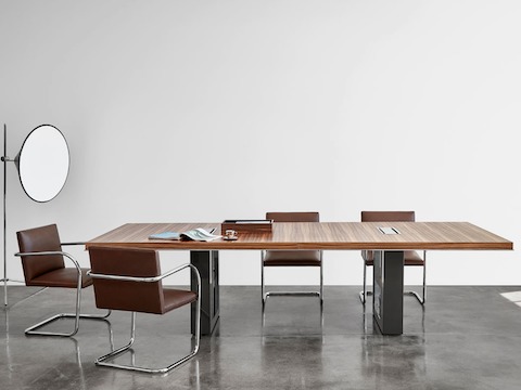 Highline 50 Conference Table by DatesWeiser in a Conference Room setting with Highline 25 Credenza, front view.