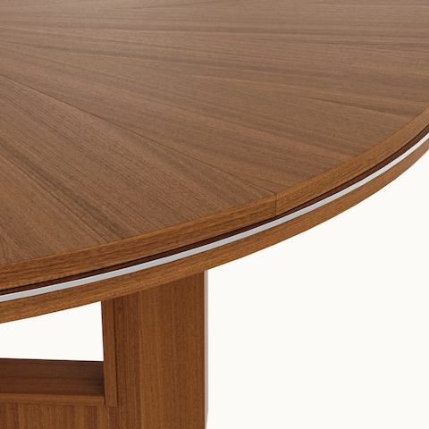 Edge detail shot of circular Highline Fifty Meeting Table by DatesWeiser in Natural Quarter Cut Walnut with Polished Chrome details.