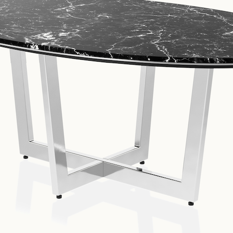Elliptical-shaped Highline Meeting Table by DatesWeiser in Nero Marquina Honed Marble with a Polished Chrome base viewed from a 45 degree angle.