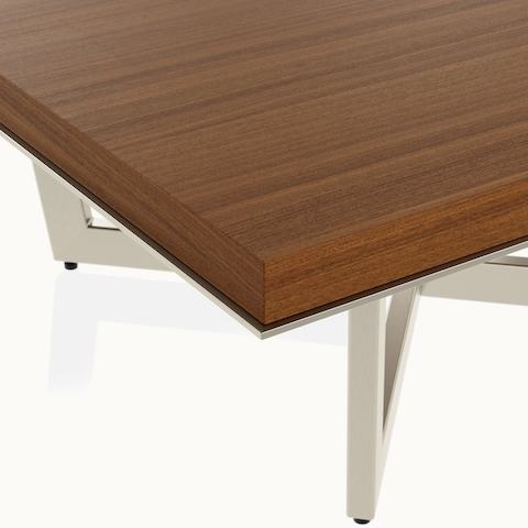 Edge detail shot of a Highline Meeting Table by DatesWeiser in Natural Quarter Cut Walnut with a Satin Nickel base.