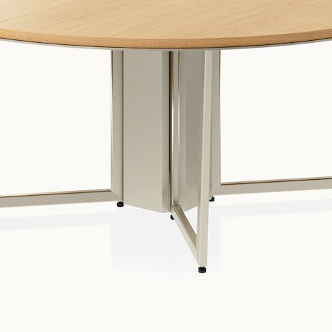 Circular Highline Meeting Table by DatesWeiser in Natural Flat Cut Oak with a Satin Nickel wire management base viewed from a 45 degree angle.