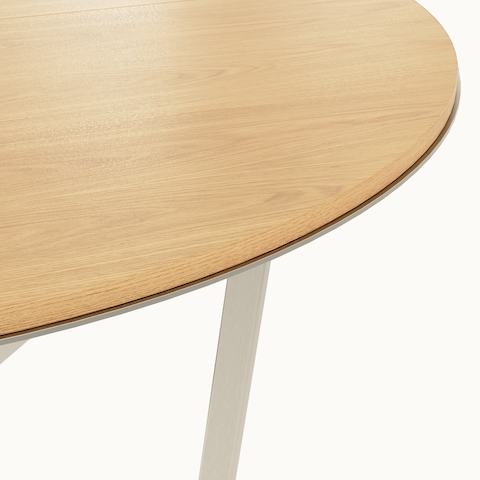 Highline Meeting Table by DatesWeiser with custom Calacatta Gold round top, Satin Nickel metal trim, detail view.