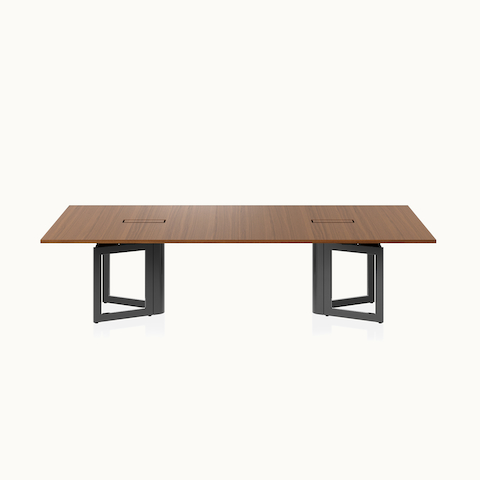 Highline Vector Conference Table by DatesWeiser in Natural Quarter Cut Walnut with a Jet Black base viewed from the front.