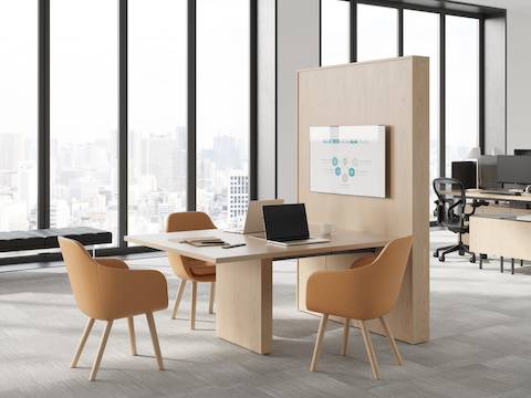 JD Media Table by DatesWeiser in Natural Oak with Saiba Side Chairs and Geiger One Open Plan Workstation in background.