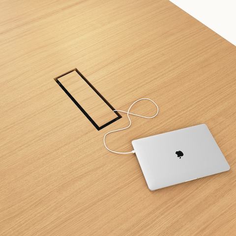 Detail shot of closed tabletop power access on JD Conference Table by DatesWeiser in Natural Rift Cut Oak.