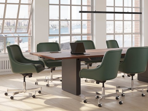 JD Conference Table and JD Credenza by DatesWeiser in Natural Walnut with Low Arm Bumper Chairs in Conference Room.