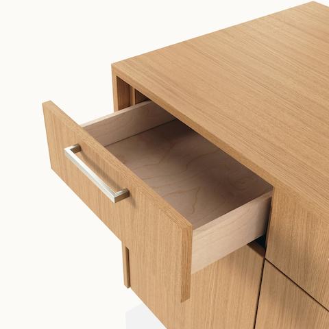 Detail shot of an open box drawer on a JD Credenza by DatesWeiser in Natural Rift Cut Oak with Satin Nickel drawer pulls.