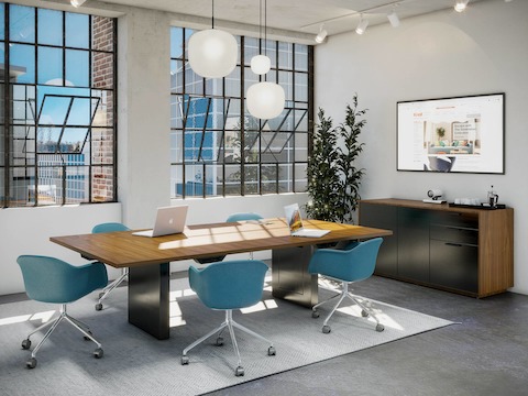 JD Conference Table by DatesWeiser with undermount technology in a conference room setting with the JD Credenza in the background.