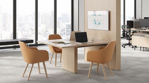 JD Media Table by DatesWeiser in Natural Oak with Saiba Side Chairs and Geiger One Open Plan Workstation in Background.