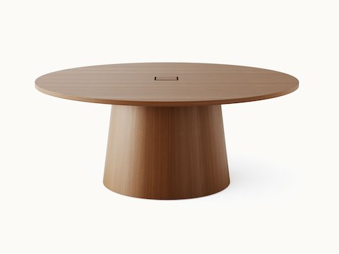 JD Meeting Table by DatesWeiser with round top and round tapered base in natural quarter cut walnut shown front-facing on a white sweep.