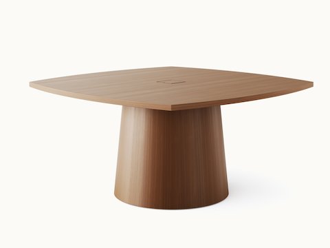 JD Meeting Table by DatesWeiser with round top and round tapered base in natural quarter cut walnut shown at an angle on a white sweep.