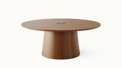 JD Meeting Table by DatesWeiser with round top and round tapered base in natural quarter cut walnut shown at an angle on a white sweep. JD Meeting Table by DatesWeiser with round top and round tapered base in natural quarter cut walnut shown at an angle on a white sweep.