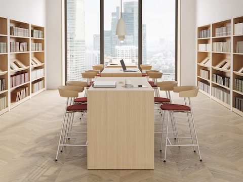 JD Waterfall Table by DatesWeiser in Oak, environmental view with Leeway Stools in a law library setting.