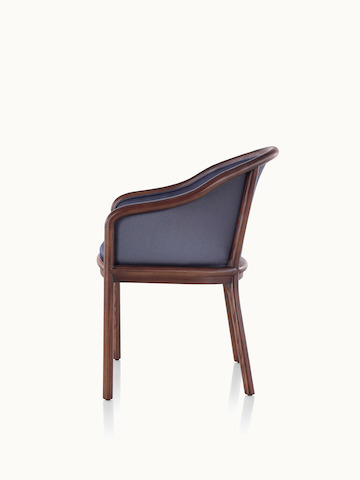 Side view of a Landmark side chair with dark blue French upholstery, a dark wood frame, and standard-height arms.