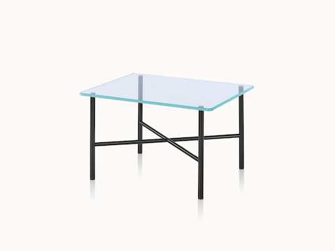 Angled view of a Layer side table with a glass top and black metal cross braces.