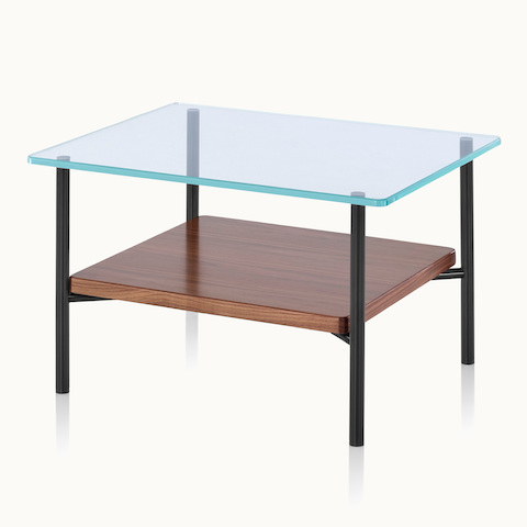 Angled view of a Layer side table with a glass top and wood lower shelf.